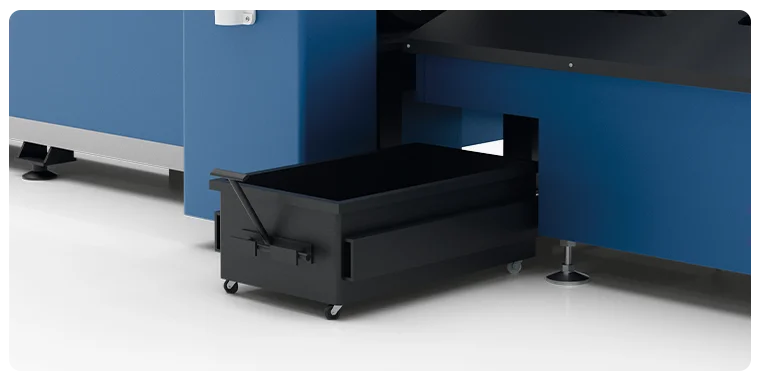 Waste and finished parts collection container under the Otinus laser cutting machine, mounted on wheels for easy sliding out and emptying.