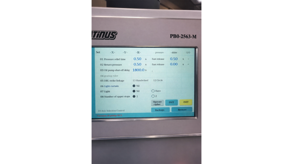 Delem DA-58T control panel on an Otinus press brake, displaying advanced settings for pressure, cycle times, safety functions, and configuration of machine axes and safety systems.